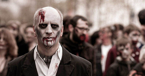 Person surrounded by zombies barely surviving for one hour