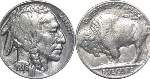 Weathered antique buffalo nickel on aged brown leather.